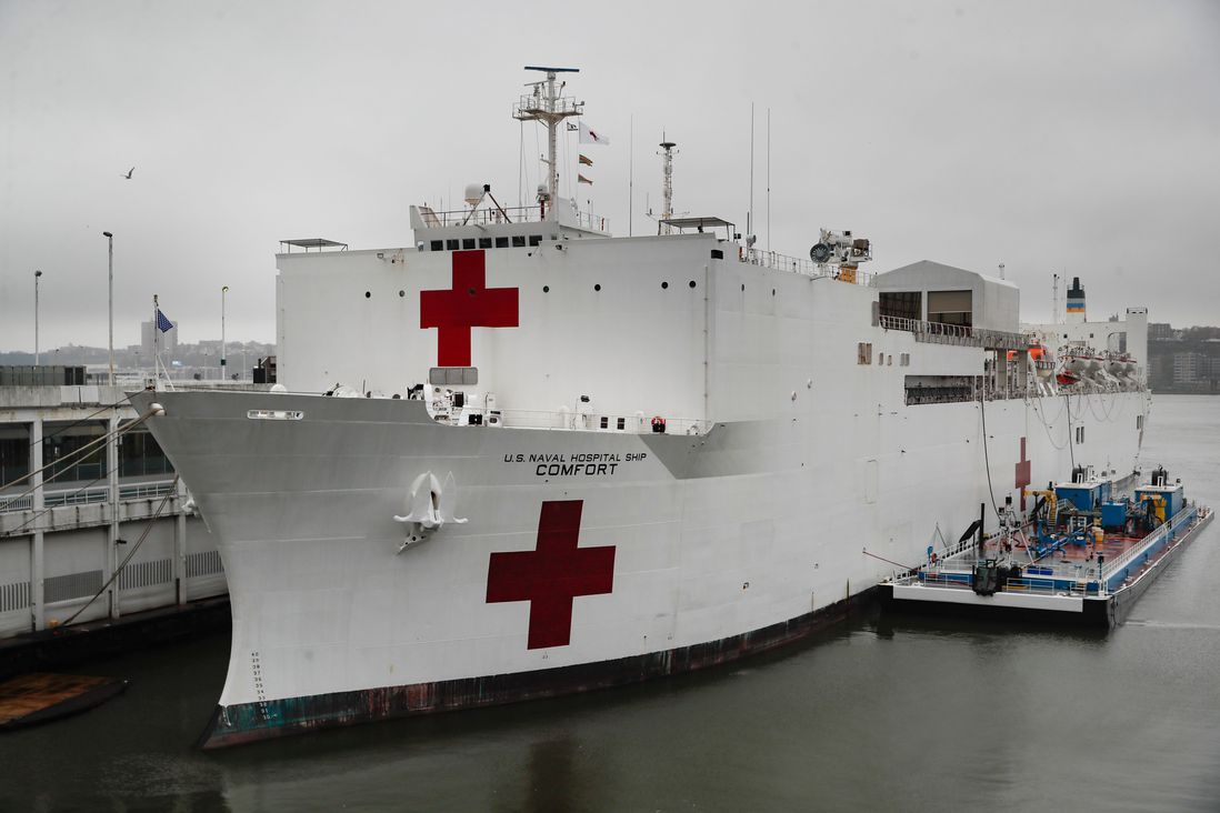 The USS Naval Hospital Ship Comfort sits docked before departing, in